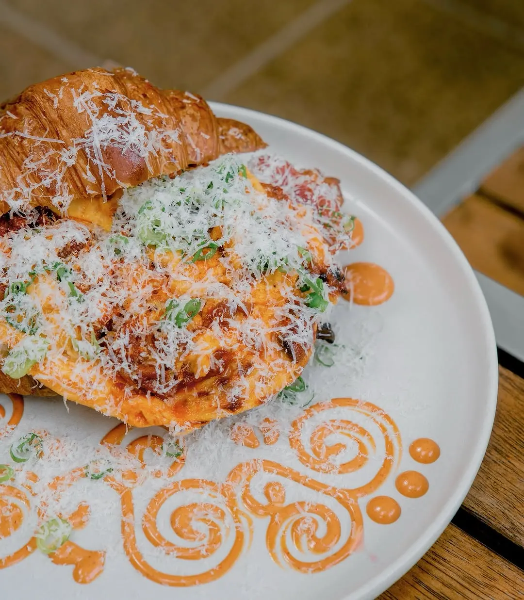Gochujang scramble croissant with parmesan snow and spiced mayo