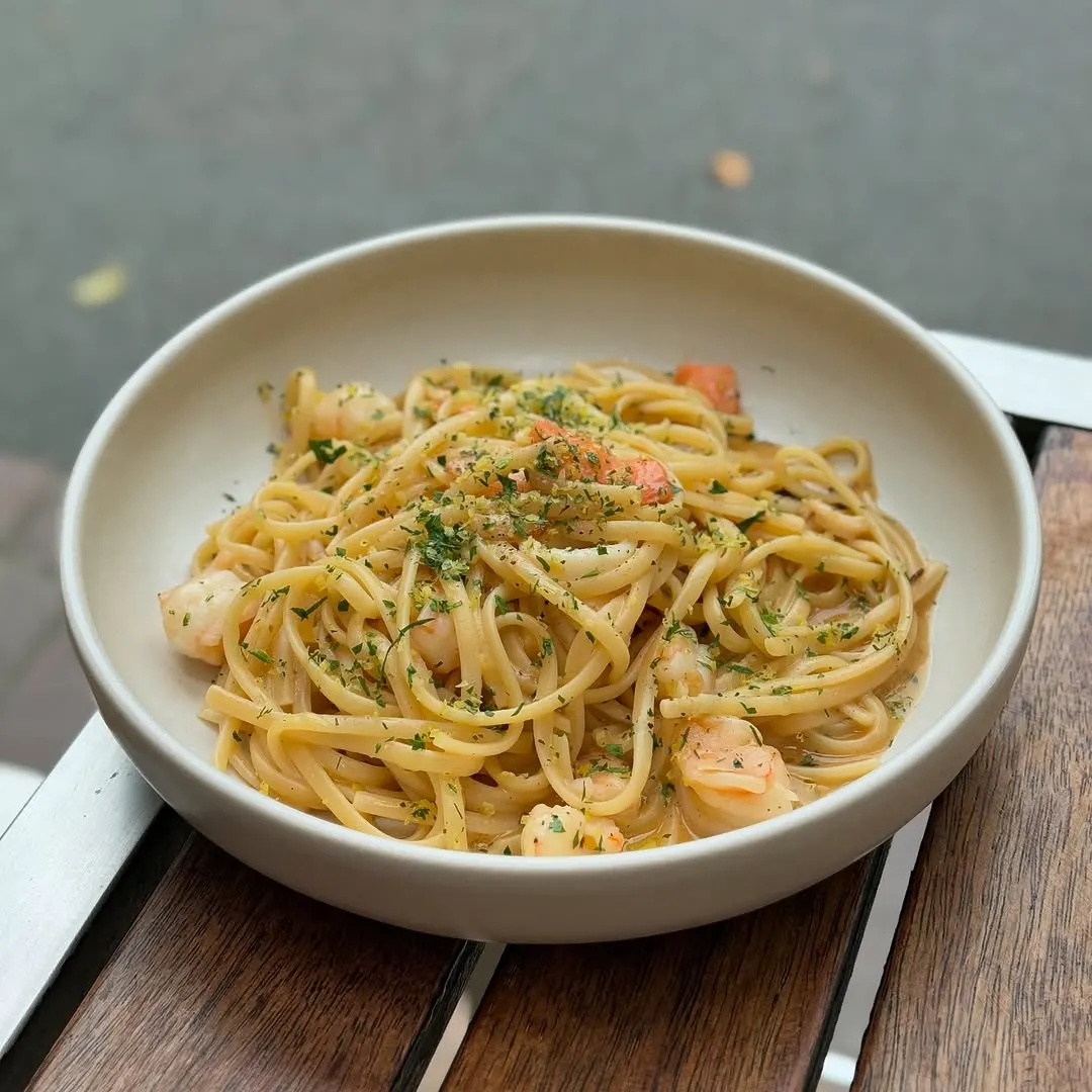 Prawn and lemon linguine in a ceramic bowl